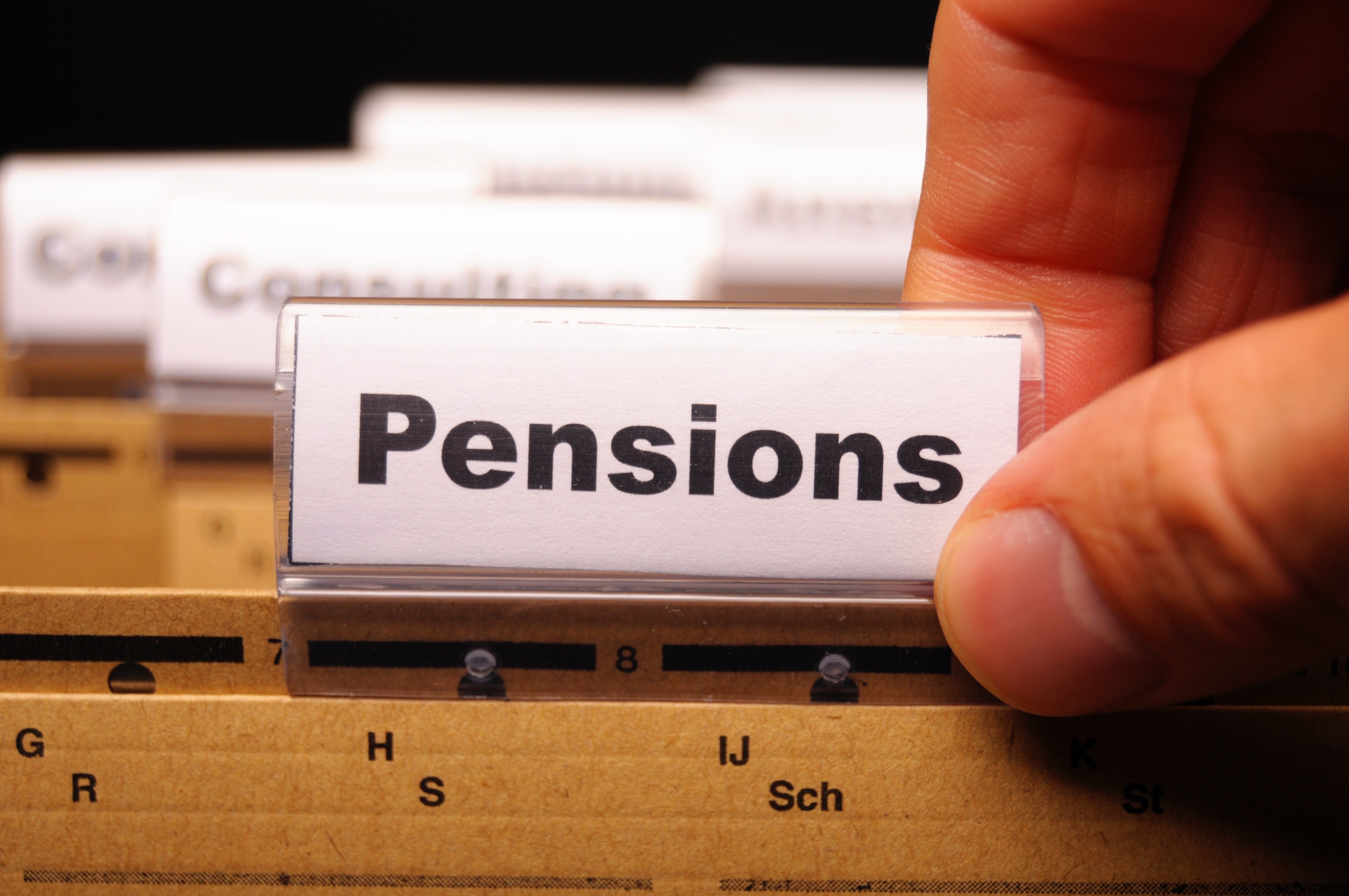 A filing cabinet folder with the word Pension