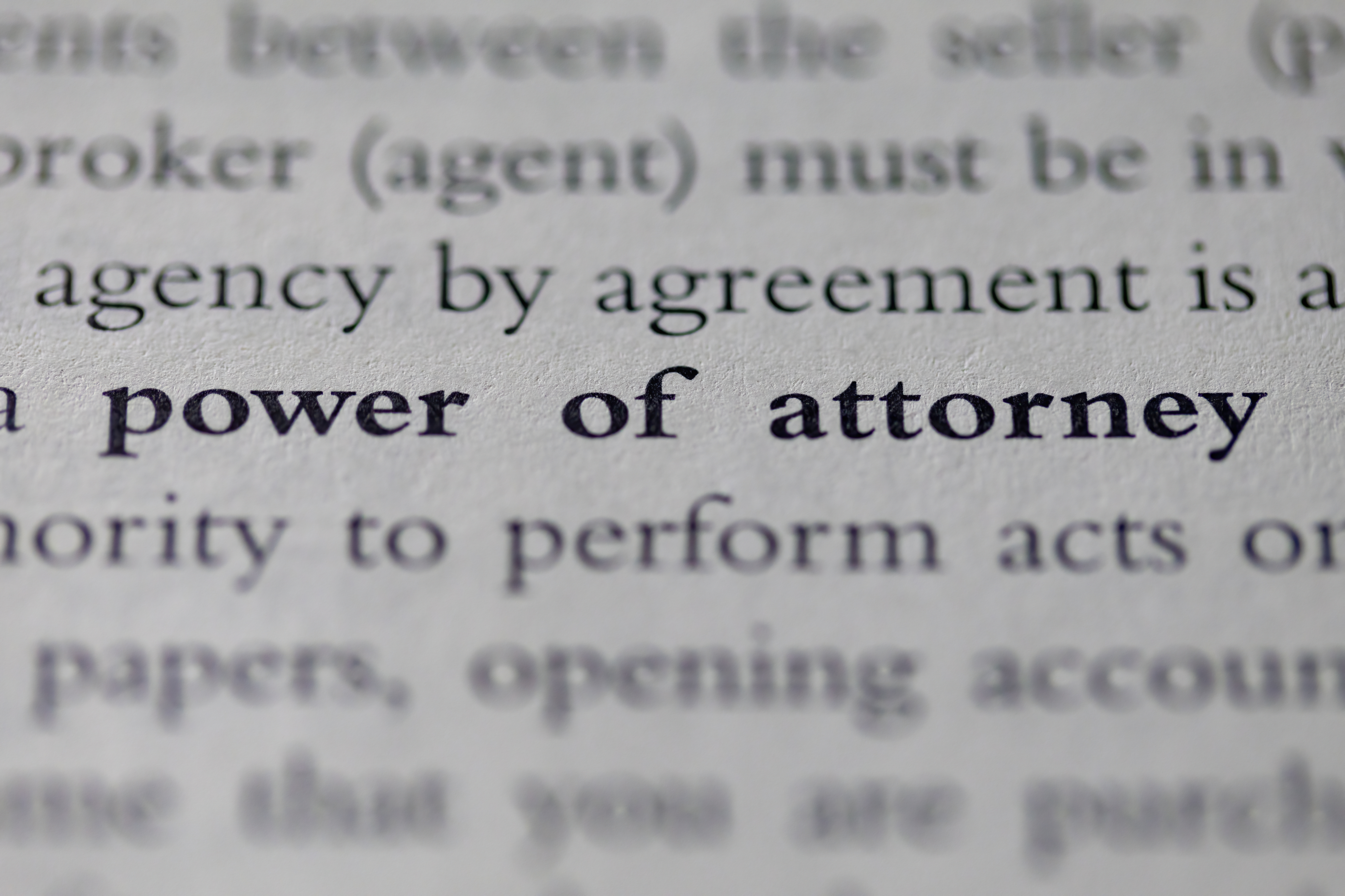 The words Power of Attorney written on paper