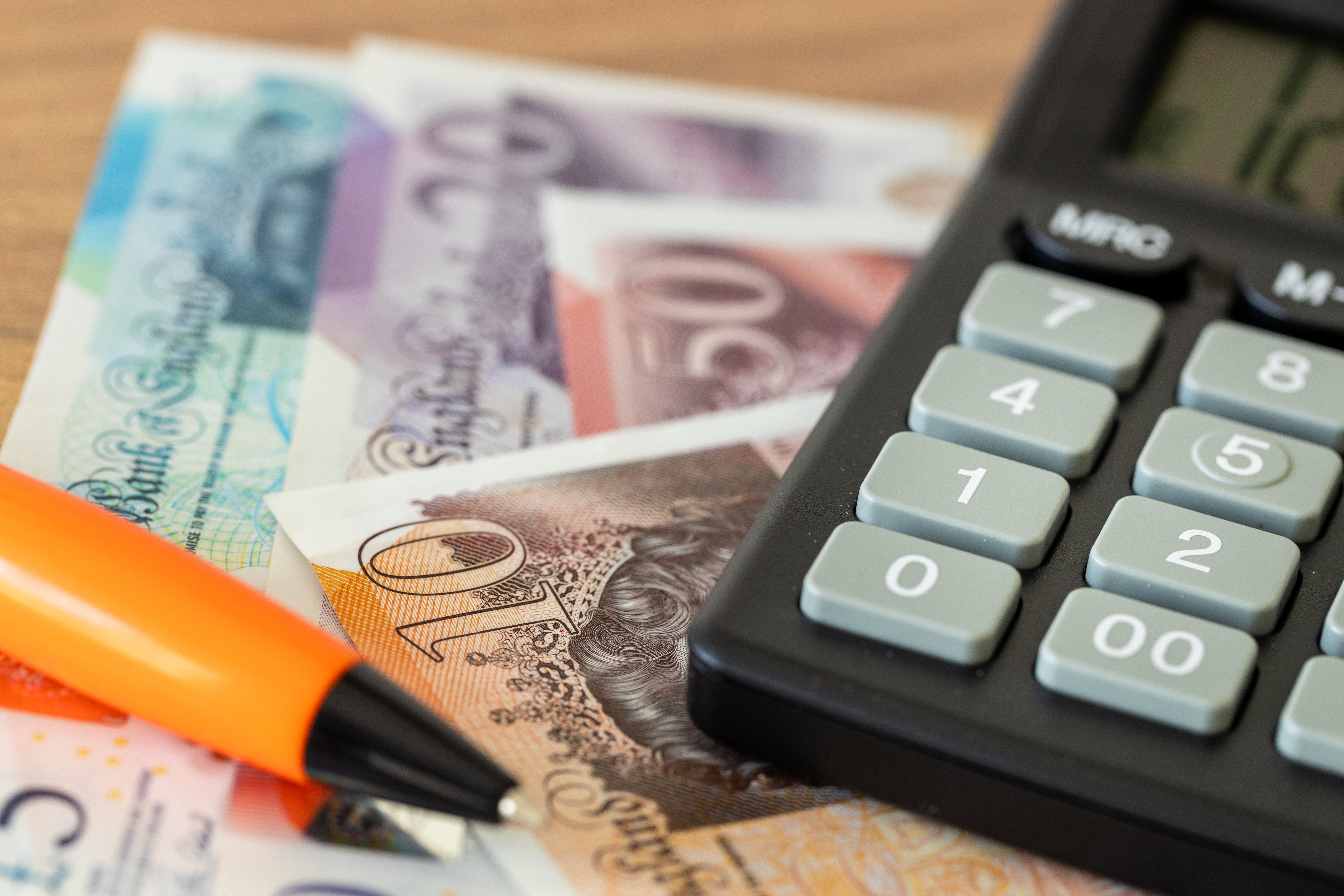 Bank Notes, Calculator and Pen