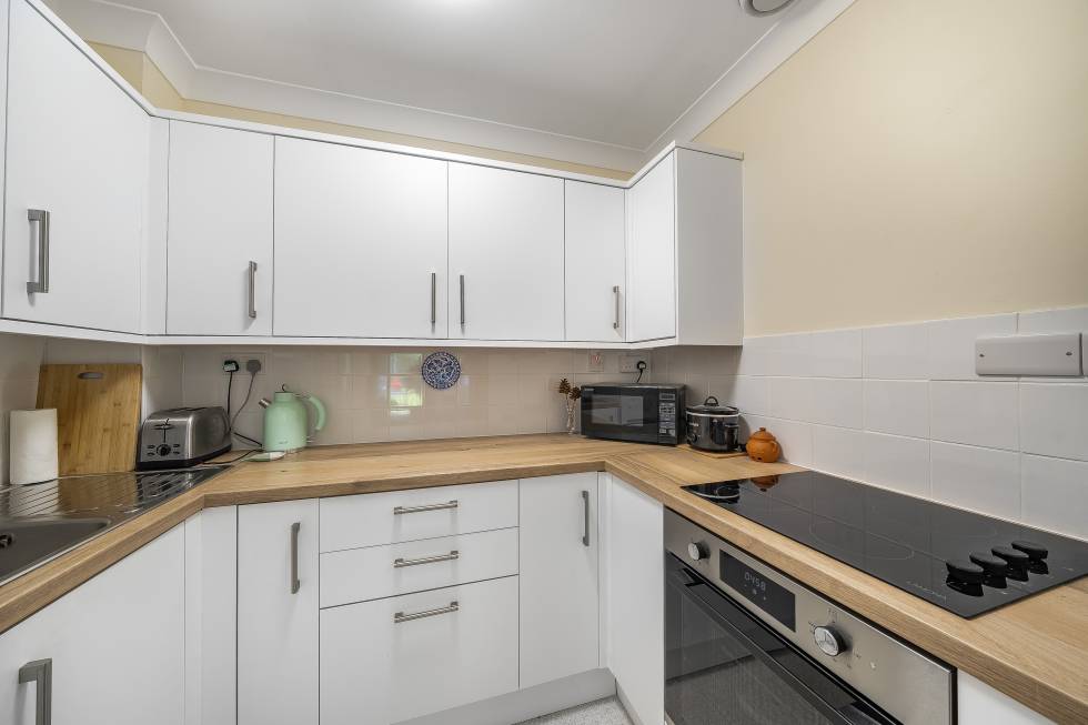 A kitchen in a flat at Gracey Court