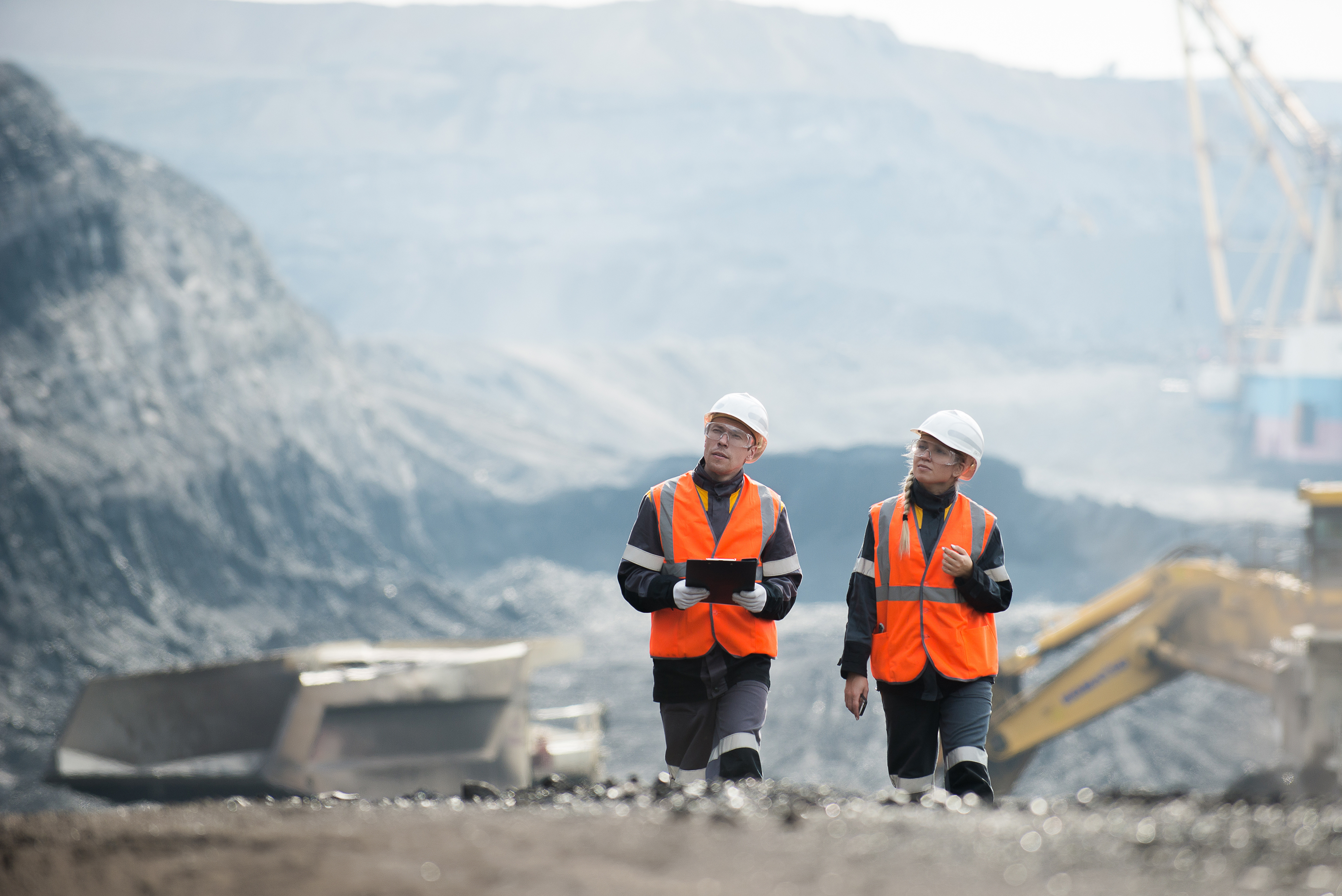 Workers with coal at open pit