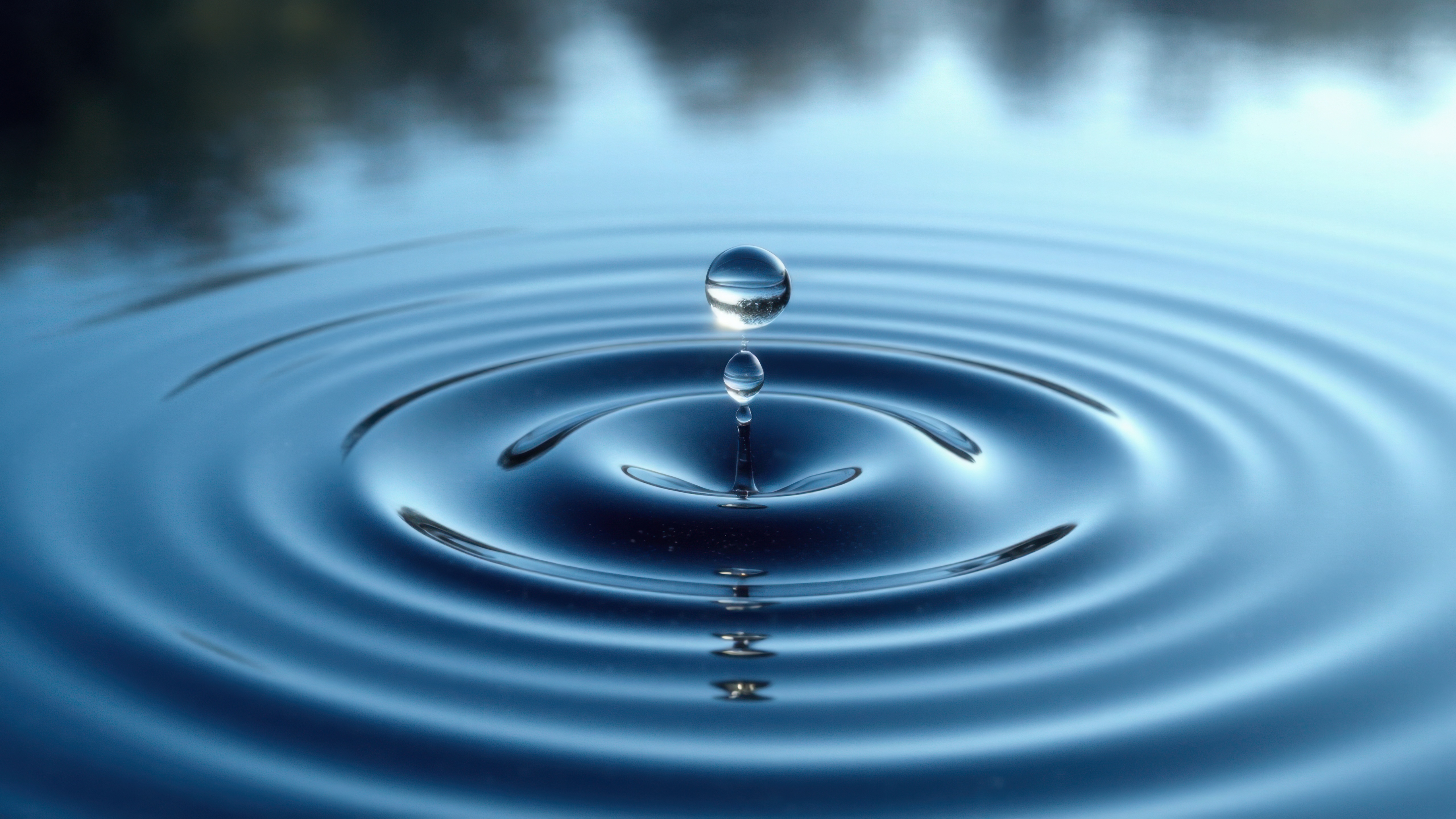 A drop of water falling into a pond