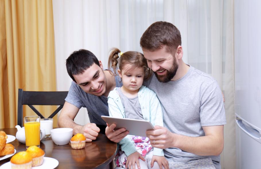 A couple with their daughter having breakfast