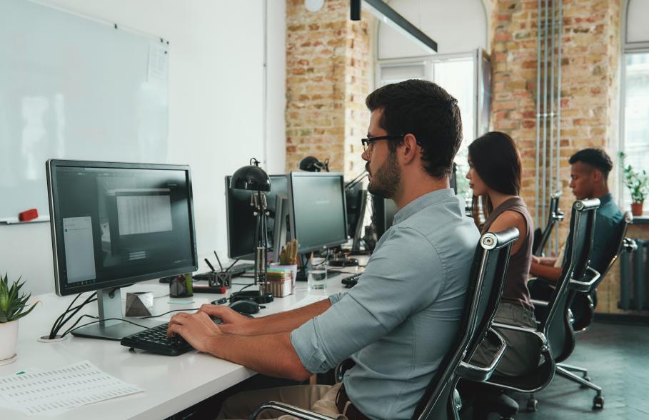 Three office workers on the computers