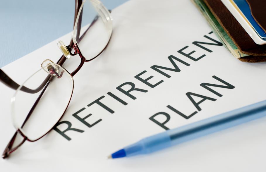 A document with the words 'Retirement Plan' with glasses and a pen