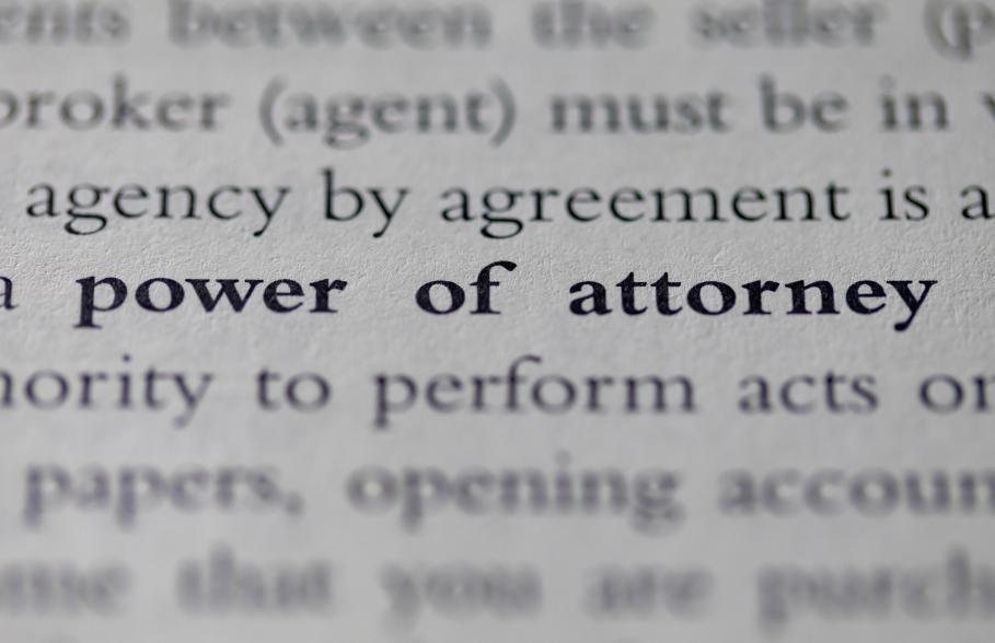 The words Power of Attorney written on paper