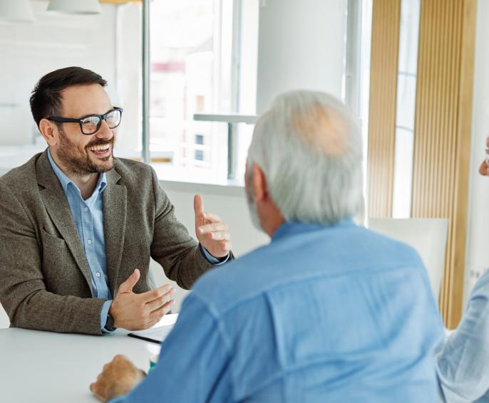 An advisor talks with a retired couple