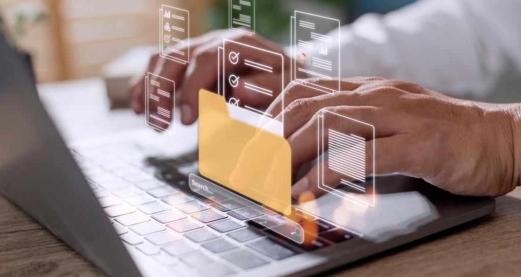 A graphic of a computer folder superimposed over a laptop